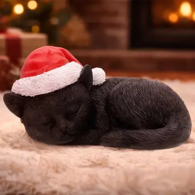 Figurine black cat sleeping with santa hat
